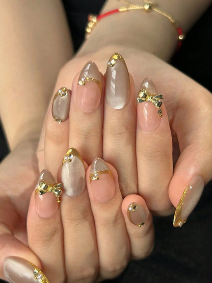 Cat Eye Almond Press-On Nails with Gold Edges & Bows