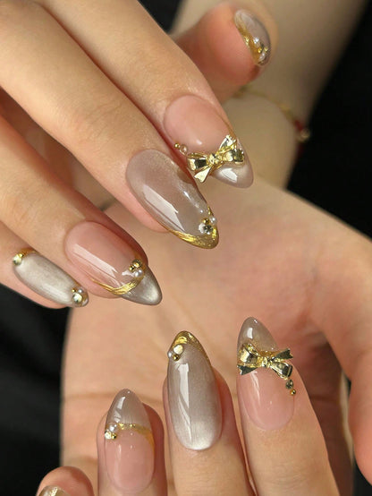Cat Eye Almond Press-On Nails with Gold Edges & Bows