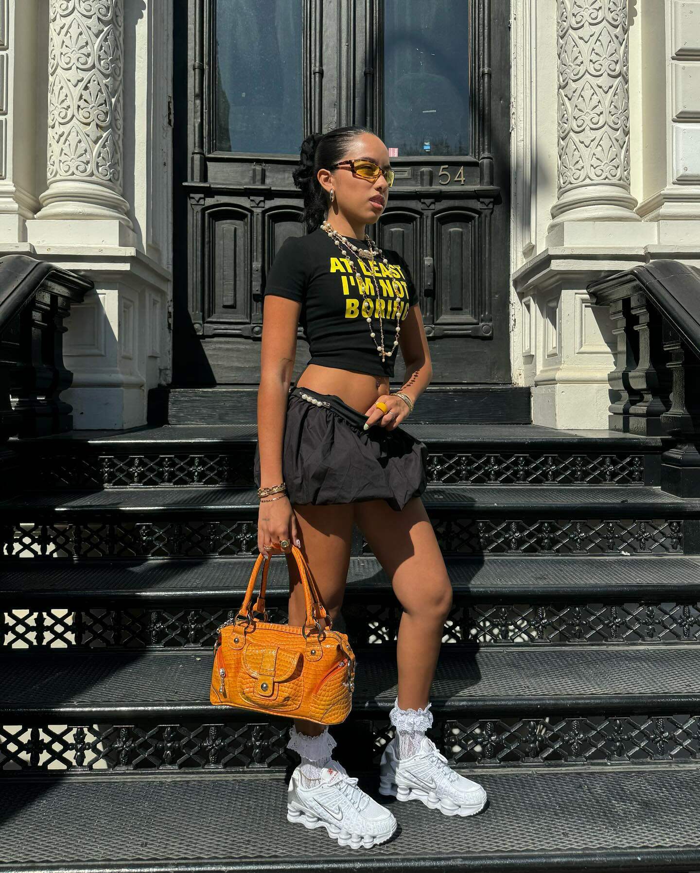 At Least I'm Not Boring Graphic Black Baby Tee