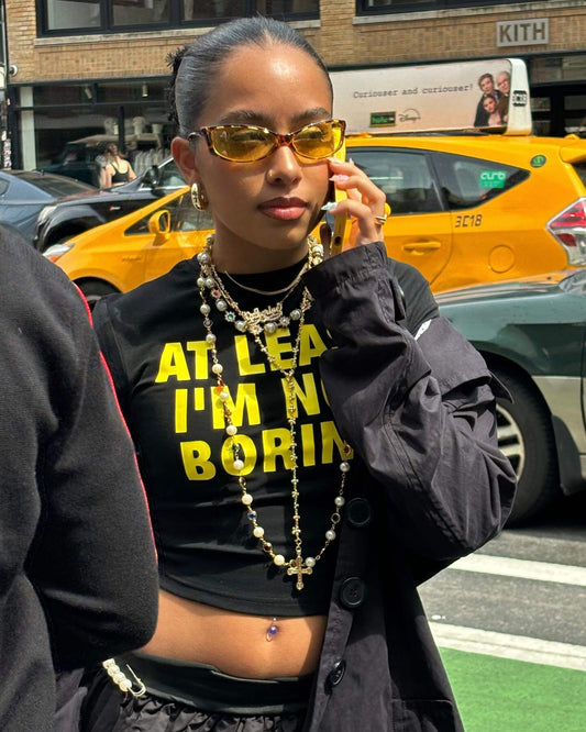 At Least I'm Not Boring Graphic Black Baby Tee