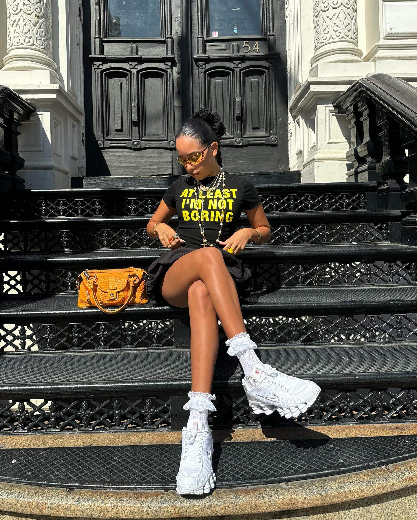 At Least I'm Not Boring Graphic Black Baby Tee